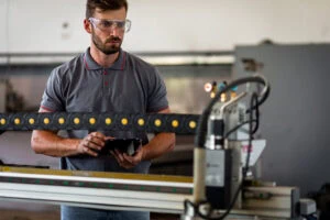 Engineer Using Plasma Laser Cutting Machine Engineer Using Plasma Laser Cutting Machine